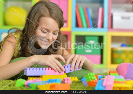 To use this stock image in your creative project, please select the size you need over to the right and click the "Add to Cart" button.
Your downloaded image will come with the Cutcaster watermark removed so don’t worry about the watermark you see on this page. Cute girl playing with colorful plastic blocks stock photo, Cute girl playing with colorful plastic blocks in room by Ruslan Huzau