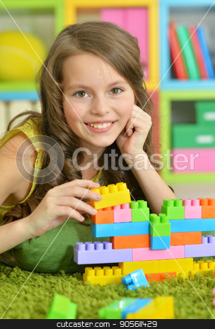 To use this stock image in your creative project, please select the size you need over to the right and click the "Add to Cart" button.
Your downloaded image will come with the Cutcaster watermark removed so don’t worry about the watermark you see on this page. Cute girl playing with colorful plastic blocks stock photo, Cute girl playing with colorful plastic blocks in room by Ruslan Huzau