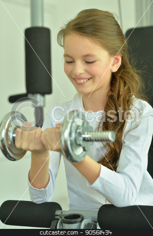 To use this stock image in your creative project, please select the size you need over to the right and click the "Add to Cart" button.
Your downloaded image will come with the Cutcaster watermark removed so don’t worry about the watermark you see on this page. Little girl doing exercises stock photo, Little girl doing exercises with dumbbell in gym by Ruslan Huzau