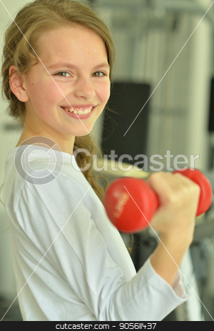 To use this stock image in your creative project, please select the size you need over to the right and click the "Add to Cart" button.
Your downloaded image will come with the Cutcaster watermark removed so don’t worry about the watermark you see on this page. Little girl doing exercises stock photo, Little girl doing exercises with dumbbell in gym by Ruslan Huzau