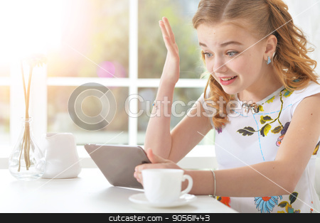 To use this stock image in your creative project, please select the size you need over to the right and click the "Add to Cart" button.
Your downloaded image will come with the Cutcaster watermark removed so don’t worry about the watermark you see on this page. Surprised little girl looking at tablet stock photo, Surprised little girl sitting at table and looking at digital tablet by Ruslan Huzau