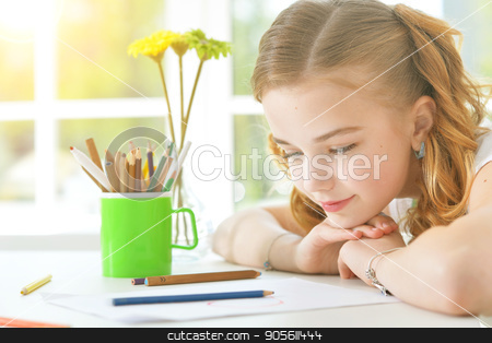 To use this stock image in your creative project, please select the size you need over to the right and click the "Add to Cart" button.
Your downloaded image will come with the Cutcaster watermark removed so don’t worry about the watermark you see on this page. Little girl looking at drawings stock photo, Pretty little girl sitting at table and looking at paper with drawings by Ruslan Huzau