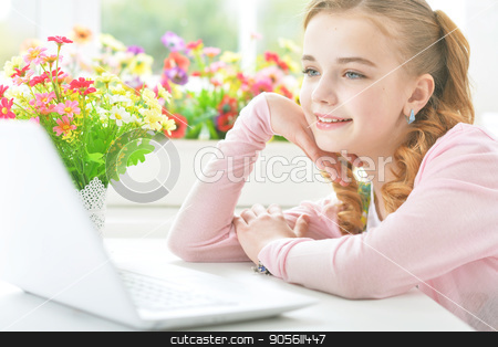 To use this stock image in your creative project, please select the size you need over to the right and click the "Add to Cart" button.
Your downloaded image will come with the Cutcaster watermark removed so don’t worry about the watermark you see on this page. Little girl with modern laptop stock photo, Pretty little girl sitting at table with modern laptop by Ruslan Huzau