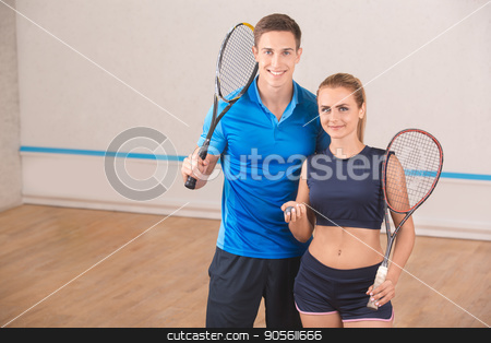 To use this stock image in your creative project, please select the size you need over to the right and click the "Add to Cart" button.
Your downloaded image will come with the Cutcaster watermark removed so don’t worry about the watermark you see on this page. Young man and woman play squash in the gym stock photo, Young man and woman squash players together game by Dmytro Sidelnikov