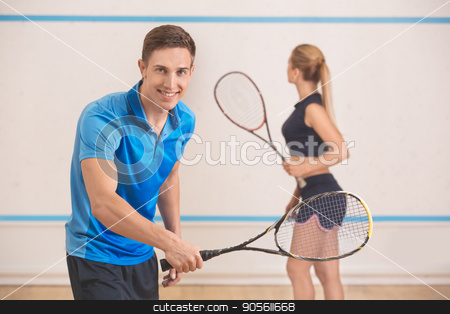 To use this stock image in your creative project, please select the size you need over to the right and click the "Add to Cart" button.
Your downloaded image will come with the Cutcaster watermark removed so don’t worry about the watermark you see on this page. Young man and woman play squash in the gym stock photo, Young man and woman squash players together game by Dmytro Sidelnikov