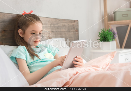 To use this stock image in your creative project, please select the size you need over to the right and click the "Add to Cart" button.
Your downloaded image will come with the Cutcaster watermark removed so don’t worry about the watermark you see on this page. Young teenager girl alone at home childhood stock photo, Young teenager girl alone at home childhood using digital device by Dmytro Sidelnikov