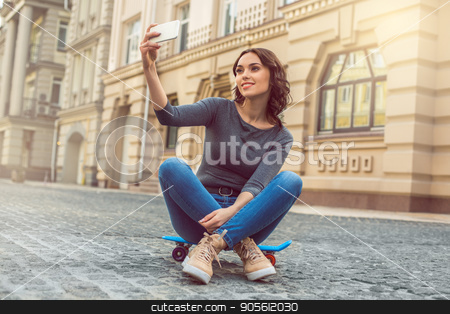 To use this stock image in your creative project, please select the size you need over to the right and click the "Add to Cart" button.
Your downloaded image will come with the Cutcaster watermark removed so don’t worry about the watermark you see on this page. Young woman city walk tourist vacation lifestyle stock photo, Young female city walk tourist vacation lifestyle with skateboard by Dmytro Sidelnikov