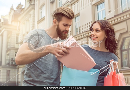 To use this stock image in your creative project, please select the size you need over to the right and click the "Add to Cart" button.
Your downloaded image will come with the Cutcaster watermark removed so don’t worry about the watermark you see on this page. Young couple tourists city walk together vacation stock photo, Young couple woman and man tourists city walk together vacation shopping by Dmytro Sidelnikov