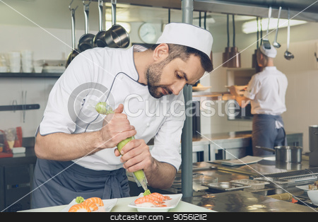 To use this stock image in your creative project, please select the size you need over to the right and click the "Add to Cart" button.
Your downloaded image will come with the Cutcaster watermark removed so don’t worry about the watermark you see on this page. Man japanese restaurant chef cooking in the kitchen stock photo, Male japanese restaurant chef cooking in the kitchen adding wasabi by Dmytro Sidelnikov