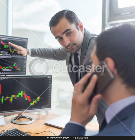 To use this stock image in your creative project, please select the size you need over to the right and click the "Add to Cart" button.
Your downloaded image will come with the Cutcaster watermark removed so don’t worry about the watermark you see on this page. Stock brokers looking at computer screens, trading online. stock photo, Businessmen trading stocks online. Stock brokers looking at graphs, indexes and numbers on multiple computer screens. Colleagues in discussion in traders office. Business success concept. by kasto