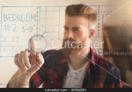 To use this stock image in your creative project, please select the size you need over to the right and click the "Add to Cart" button.
Your downloaded image will come with the Cutcaster watermark removed so don’t worry about the watermark you see on this page. Young man architect working in the office ocuupation stock photo, Young male architect working indoors planning draft by Dmytro Sidelnikov
