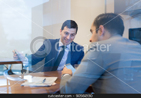 To use this stock image in your creative project, please select the size you need over to the right and click the "Add to Cart" button.
Your downloaded image will come with the Cutcaster watermark removed so don’t worry about the watermark you see on this page. Two young businessmen using smart phones and touchpad at meeting. stock photo, Image of two young businessmen using smart phones and touchpad at meeting in moder office. by kasto