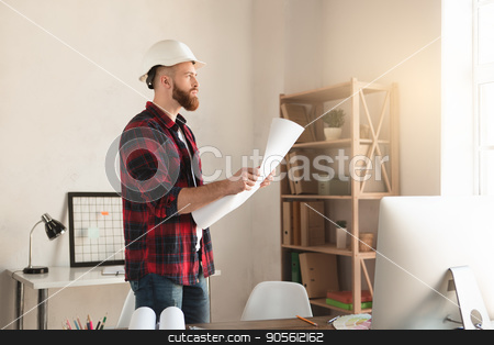 To use this stock image in your creative project, please select the size you need over to the right and click the "Add to Cart" button.
Your downloaded image will come with the Cutcaster watermark removed so don’t worry about the watermark you see on this page. Young man architect working in the office ocuupation stock photo, Young male architect working indoors draft blueprint by Dmytro Sidelnikov