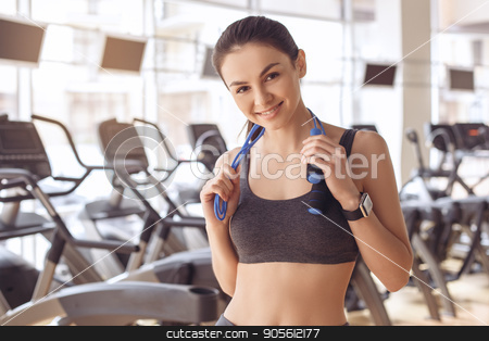 To use this stock image in your creative project, please select the size you need over to the right and click the "Add to Cart" button.
Your downloaded image will come with the Cutcaster watermark removed so don’t worry about the watermark you see on this page. Young woman workout in gym healthy lifestyle stock photo, Young female training in gym healthy lifestyle holding skipping rope by Dmytro Sidelnikov