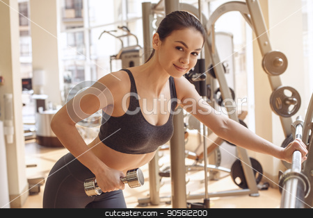 To use this stock image in your creative project, please select the size you need over to the right and click the "Add to Cart" button.
Your downloaded image will come with the Cutcaster watermark removed so don’t worry about the watermark you see on this page. Young woman workout in gym healthy lifestyle stock photo, Young female training in gym healthy lifestyle exercise with dumbbells by Dmytro Sidelnikov