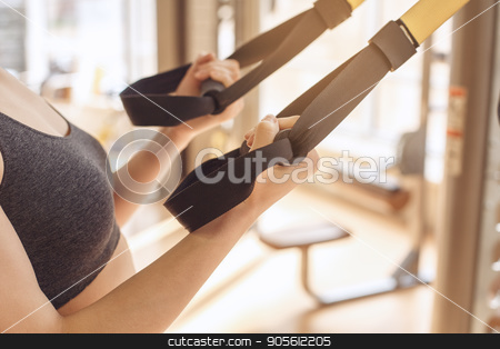 To use this stock image in your creative project, please select the size you need over to the right and click the "Add to Cart" button.
Your downloaded image will come with the Cutcaster watermark removed so don’t worry about the watermark you see on this page. Young woman workout in gym healthy lifestyle stock photo, Young female training in gym healthy lifestyle pulling weights by Dmytro Sidelnikov