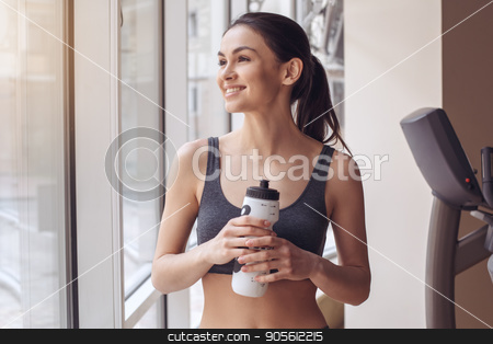To use this stock image in your creative project, please select the size you need over to the right and click the "Add to Cart" button.
Your downloaded image will come with the Cutcaster watermark removed so don’t worry about the watermark you see on this page. Young woman workout in gym healthy lifestyle stock photo, Young female training in gym healthy lifestyle drinking water by Dmytro Sidelnikov