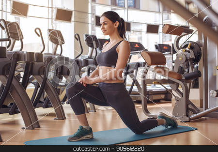 To use this stock image in your creative project, please select the size you need over to the right and click the "Add to Cart" button.
Your downloaded image will come with the Cutcaster watermark removed so don’t worry about the watermark you see on this page. Young woman workout in gym healthy lifestyle stock photo, Young female training in gym healthy lifestyle exercise on yoga mat by Dmytro Sidelnikov