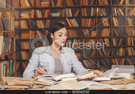 To use this stock image in your creative project, please select the size you need over to the right and click the "Add to Cart" button.
Your downloaded image will come with the Cutcaster watermark removed so don’t worry about the watermark you see on this page. Young woman study in the library alone stock photo, Young female study in the library reading book by Dmytro Sidelnikov