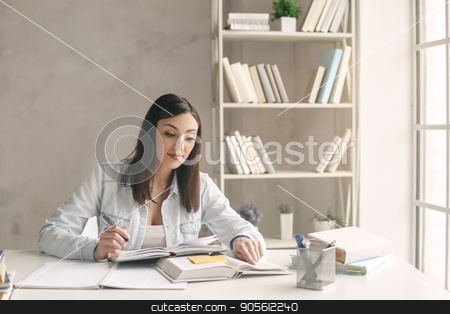 To use this stock image in your creative project, please select the size you need over to the right and click the "Add to Cart" button.
Your downloaded image will come with the Cutcaster watermark removed so don’t worry about the watermark you see on this page. Young woman study at home alone education stock photo, Young woman study at home alone reading a book by Dmytro Sidelnikov