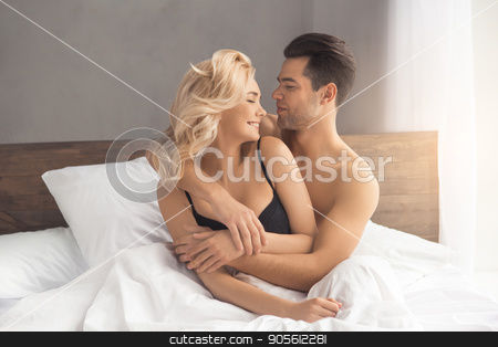 To use this stock image in your creative project, please select the size you need over to the right and click the "Add to Cart" button.
Your downloaded image will come with the Cutcaster watermark removed so don’t worry about the watermark you see on this page. Young couple intimate relationship on bed passion stock photo, Young couple man and woman intimate relationship on bed hugging by Dmytro Sidelnikov