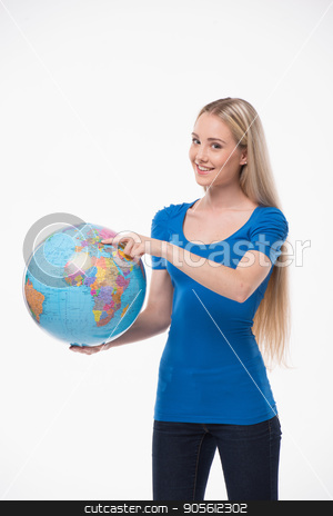 To use this stock image in your creative project, please select the size you need over to the right and click the "Add to Cart" button.
Your downloaded image will come with the Cutcaster watermark removed so don’t worry about the watermark you see on this page. Beautiful young woman on white background stock photo, Travel concept. Portrait of stylish beautiful young woman isolated on white background. Woman smiling, pointing at globe by Dmytro Sidelnikov