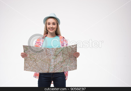 To use this stock image in your creative project, please select the size you need over to the right and click the "Add to Cart" button.
Your downloaded image will come with the Cutcaster watermark removed so don’t worry about the watermark you see on this page. Beautiful young woman on white background stock photo, Travel concept. Portrait of stylish beautiful young woman isolated on white background. Woman smiling and using map. Free space for logo by Dmytro Sidelnikov