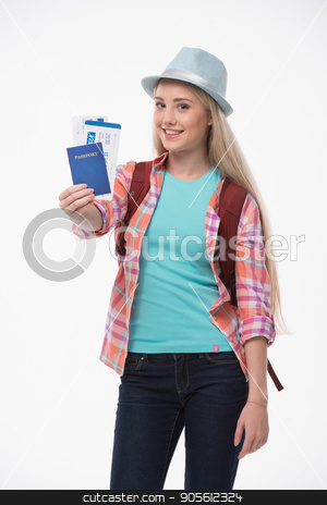 To use this stock image in your creative project, please select the size you need over to the right and click the "Add to Cart" button.
Your downloaded image will come with the Cutcaster watermark removed so don’t worry about the watermark you see on this page. Beautiful young woman on white background stock photo, Travel concept. Portrait of stylish beautiful young woman isolated on white background. Woman with backpack smiling, looking at camera and showing passport with tickets by Dmytro Sidelnikov