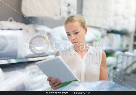 To use this stock image in your creative project, please select the size you need over to the right and click the "Add to Cart" button.
Your downloaded image will come with the Cutcaster watermark removed so don’t worry about the watermark you see on this page. Woman choosing the right item for her apartment in a modern home furnishings store. stock photo, Pretty, young woman choosing the right item for her apartment in a modern home decor furnishings store. Shopping in retail store. by kasto