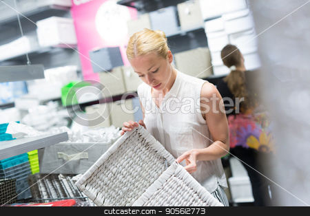 To use this stock image in your creative project, please select the size you need over to the right and click the "Add to Cart" button.
Your downloaded image will come with the Cutcaster watermark removed so don’t worry about the watermark you see on this page. Woman choosing the right item for her apartment in a modern home furnishings store. stock photo, Beautiful young caucasian woman choosing the right item for her apartment in a modern home decor furnishings store. Shopping in retail store. by kasto