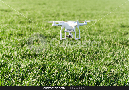 To use this stock image in your creative project, please select the size you need over to the right and click the "Add to Cart" button.
Your downloaded image will come with the Cutcaster watermark removed so don’t worry about the watermark you see on this page. quadcopter outdoors, aerial imagery and recreation concept - low flying white drone with four propellers and build-in digital camera at background of summer grass field, quadrocopter on takeoff. stock photo, quadcopter outdoors, aerial imagery and recreation concept - low flying white drone with four propellers and build-in digital camera at background of summer grass field, quadrocopter on takeoff by Dmitry
