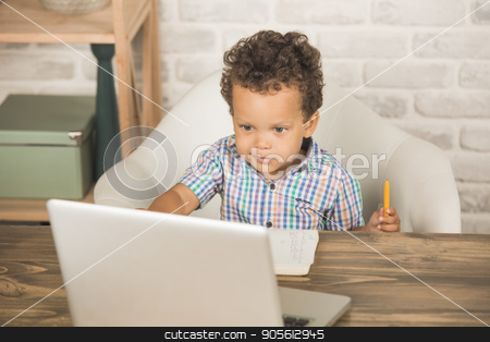 To use this stock image in your creative project, please select the size you need over to the right and click the "Add to Cart" button.
Your downloaded image will come with the Cutcaster watermark removed so don’t worry about the watermark you see on this page. Little Boy Using Digital Device Modern Technology stock photo, Little boy sitting using laptop modern technology by Dmytro Sidelnikov