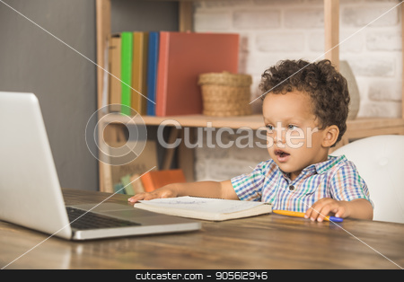 To use this stock image in your creative project, please select the size you need over to the right and click the "Add to Cart" button.
Your downloaded image will come with the Cutcaster watermark removed so don’t worry about the watermark you see on this page. Little Boy Using Digital Device Modern Technology stock photo, Little boy sitting using laptop modern technology by Dmytro Sidelnikov