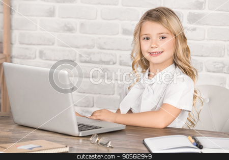 To use this stock image in your creative project, please select the size you need over to the right and click the "Add to Cart" button.
Your downloaded image will come with the Cutcaster watermark removed so don’t worry about the watermark you see on this page. Little Girl Using Digital Device Modern Technology stock photo, Little girl sitting using laptop modern technology by Dmytro Sidelnikov