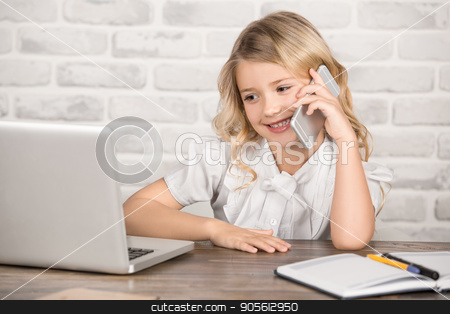 To use this stock image in your creative project, please select the size you need over to the right and click the "Add to Cart" button.
Your downloaded image will come with the Cutcaster watermark removed so don’t worry about the watermark you see on this page. Little Girl Using Digital Device Modern Technology stock photo, Little girl sitting using laptop modern technology by Dmytro Sidelnikov