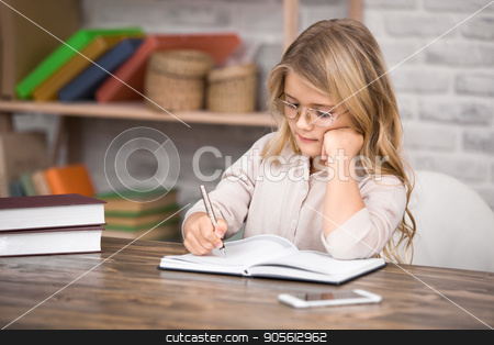 To use this stock image in your creative project, please select the size you need over to the right and click the "Add to Cart" button.
Your downloaded image will come with the Cutcaster watermark removed so don’t worry about the watermark you see on this page. Little Girl Study Learning Education Knowledge Concept stock photo, Little girl study school homework smart student by Dmytro Sidelnikov