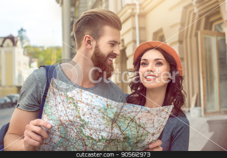 To use this stock image in your creative project, please select the size you need over to the right and click the "Add to Cart" button.
Your downloaded image will come with the Cutcaster watermark removed so don’t worry about the watermark you see on this page. Young couple tourists city walk together vacation stock photo, Young couple woman and man tourists city walk together vacation holding map by Dmytro Sidelnikov