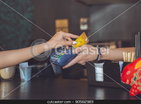 To use this stock image in your creative project, please select the size you need over to the right and click the "Add to Cart" button.
Your downloaded image will come with the Cutcaster watermark removed so don’t worry about the watermark you see on this page. Young woman sitting in a coffee shop leisure stock photo, Young female sitting in a cafe indoors rest cashless payment by Dmytro Sidelnikov