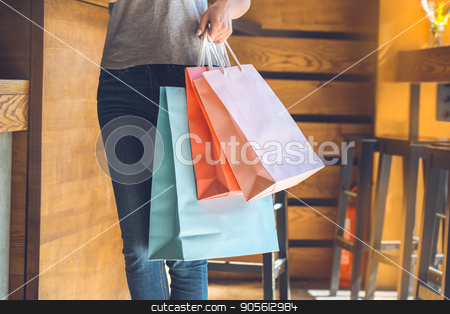 To use this stock image in your creative project, please select the size you need over to the right and click the "Add to Cart" button.
Your downloaded image will come with the Cutcaster watermark removed so don’t worry about the watermark you see on this page. Young woman standing in a coffee shop leisure stock photo, Young female standing in a cafe indoors rest holding shopping bags by Dmytro Sidelnikov