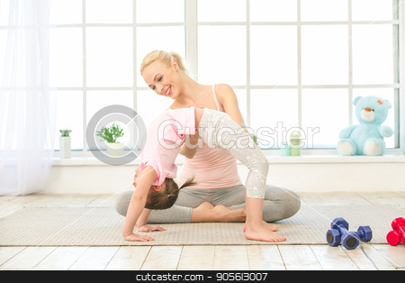 To use this stock image in your creative project, please select the size you need over to the right and click the "Add to Cart" button.
Your downloaded image will come with the Cutcaster watermark removed so don’t worry about the watermark you see on this page. Young mother and daughter exercise together indoors stock photo, Young mother and little daughter exercise together in the morning at home by Dmytro Sidelnikov