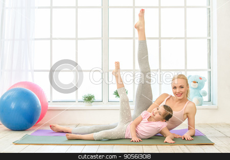 To use this stock image in your creative project, please select the size you need over to the right and click the "Add to Cart" button.
Your downloaded image will come with the Cutcaster watermark removed so don’t worry about the watermark you see on this page. Young mother and daughter exercise together indoors stock photo, Young mother and little daughter exercise together in the morning at home by Dmytro Sidelnikov