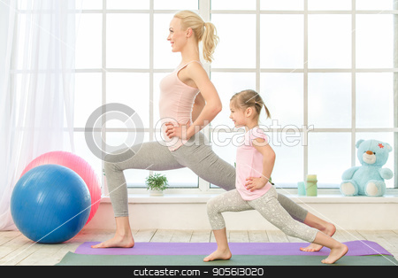 To use this stock image in your creative project, please select the size you need over to the right and click the "Add to Cart" button.
Your downloaded image will come with the Cutcaster watermark removed so don’t worry about the watermark you see on this page. Young mother and daughter exercise together indoors stock photo, Young mother and little daughter exercise together in the morning at home by Dmytro Sidelnikov