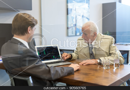 To use this stock image in your creative project, please select the size you need over to the right and click the "Add to Cart" button.
Your downloaded image will come with the Cutcaster watermark removed so don’t worry about the watermark you see on this page. Financial advisor consulting senior client with his investment strategy. stock photo, Young financial advisor sitting in front of laptop, consulting senior client with his investment strategy. by kasto