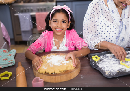 To use this stock image in your creative project, please select the size you need over to the right and click the "Add to Cart" button.
Your downloaded image will come with the Cutcaster watermark removed so don’t worry about the watermark you see on this page. Portrait of smiling girl preparing food in kitchen stock photo, Portrait of smiling girl preparing food in kitchen at home by Wavebreak Media