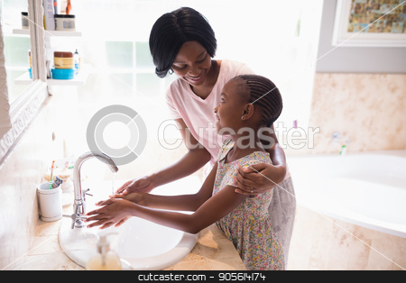 To use this stock image in your creative project, please select the size you need over to the right and click the "Add to Cart" button.
Your downloaded image will come with the Cutcaster watermark removed so don’t worry about the watermark you see on this page. Mother and daughter washing hands at sink in bathroom stock photo, High angle view of mother and daughter washing hands at sink in bathroom by Wavebreak Media