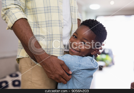 To use this stock image in your creative project, please select the size you need over to the right and click the "Add to Cart" button.
Your downloaded image will come with the Cutcaster watermark removed so don’t worry about the watermark you see on this page. Mid section of happy boy embracing father stock photo, Mid section of happy boy embracing father at home by Wavebreak Media