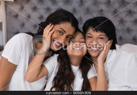To use this stock image in your creative project, please select the size you need over to the right and click the "Add to Cart" button.
Your downloaded image will come with the Cutcaster watermark removed so don’t worry about the watermark you see on this page. Portrait of smiling multi-generation embracing on bed stock photo, Portrait of smiling multi-generation embracing on bed at home by Wavebreak Media