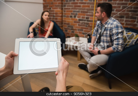To use this stock image in your creative project, please select the size you need over to the right and click the "Add to Cart" button.
Your downloaded image will come with the Cutcaster watermark removed so don’t worry about the watermark you see on this page. Executive using digital tablet and colleagues discussing in background stock photo, Executive using digital tablet and colleagues discussing in background at office by Wavebreak Media