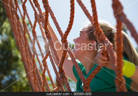 To use this stock image in your creative project, please select the size you need over to the right and click the "Add to Cart" button.
Your downloaded image will come with the Cutcaster watermark removed so don’t worry about the watermark you see on this page. Determined woman climbing a net during obstacle course training stock photo, Determined woman climbing a net during obstacle course training in the boot camp by Wavebreak Media