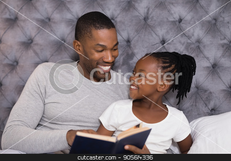 To use this stock image in your creative project, please select the size you need over to the right and click the "Add to Cart" button.
Your downloaded image will come with the Cutcaster watermark removed so don’t worry about the watermark you see on this page. Happy man with daughter reading book on bed stock photo, Happy man with daughter reading book while sitting on bed at home by Wavebreak Media